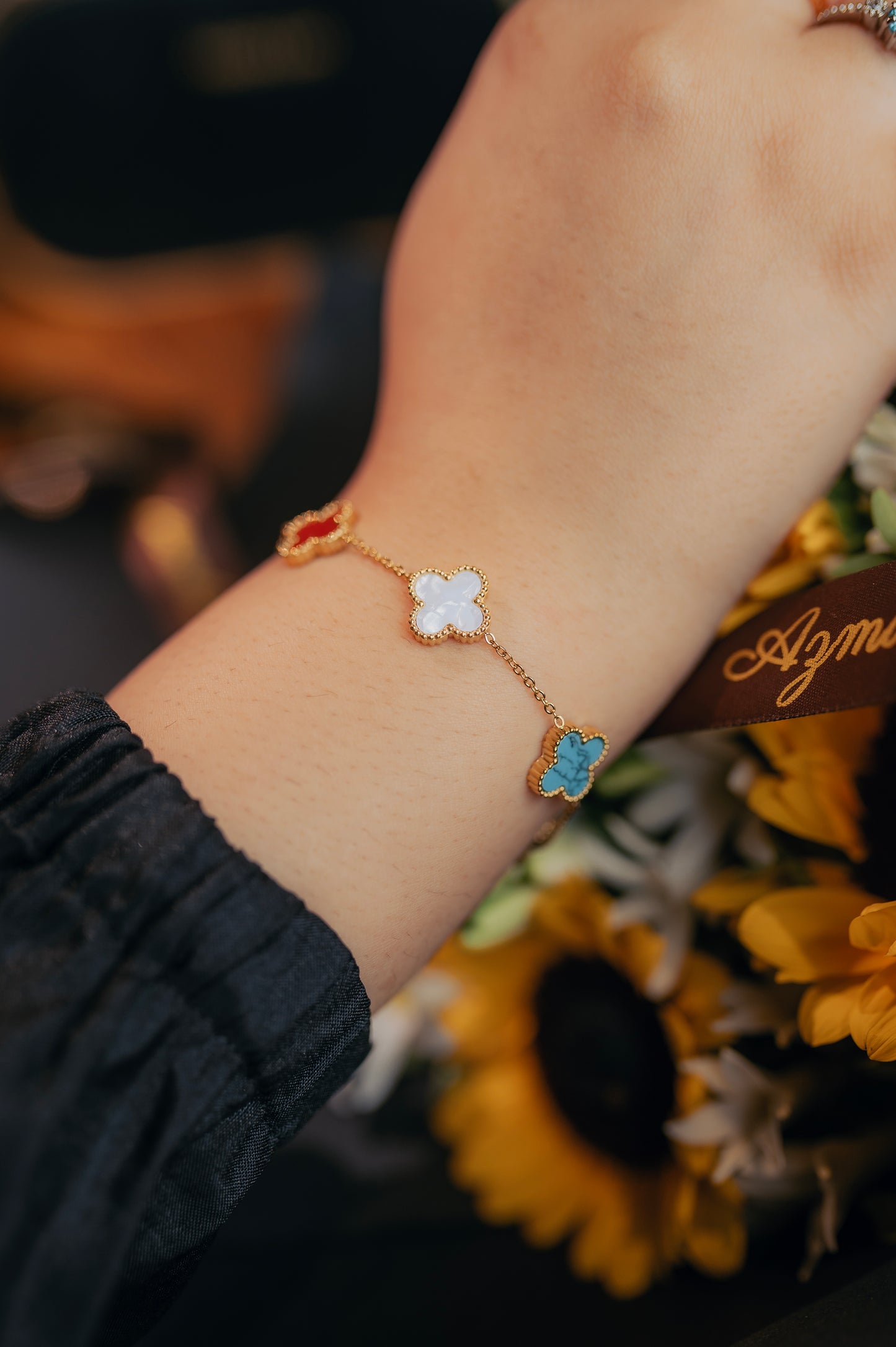 Lucky Clover Enamel Bracelet – Multicolor Floral Charms in Gold Finish