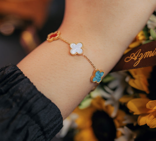 Lucky Clover Enamel Bracelet – Multicolor Floral Charms in Gold Finish